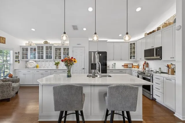 a bedroom with furniture and a flat screen tv