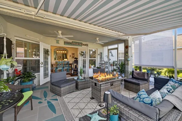 an aerial view of residential houses with outdoor space and lake view
