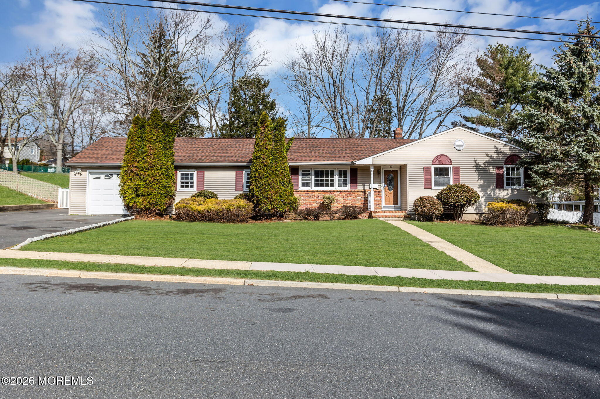 50 Westbrook Road Howell, NJ 07731 - Photo 73 of 73 a front view of a house with a yard and garage