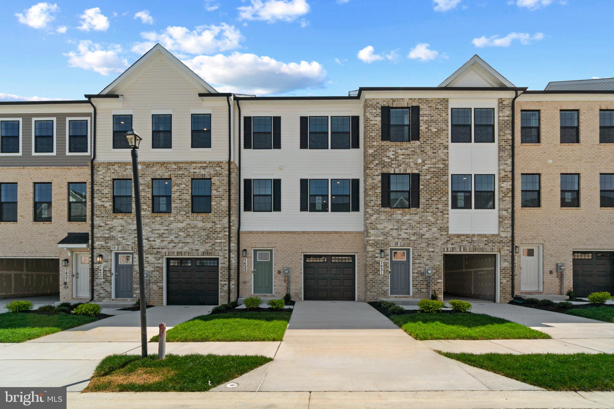 7510 Fern Gully Way Brandywine, MD 20613 - Photo 1 of 31 a front view of a house with yard and garage