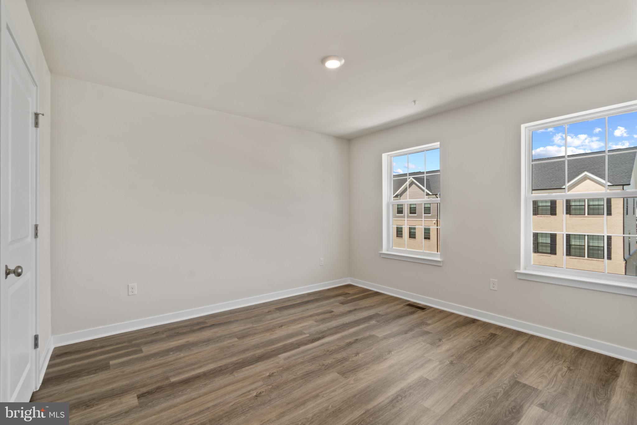 7510 Fern Gully Way Brandywine, MD 20613 - Photo 14 of 31 a view of a big room with wooden floor and windows