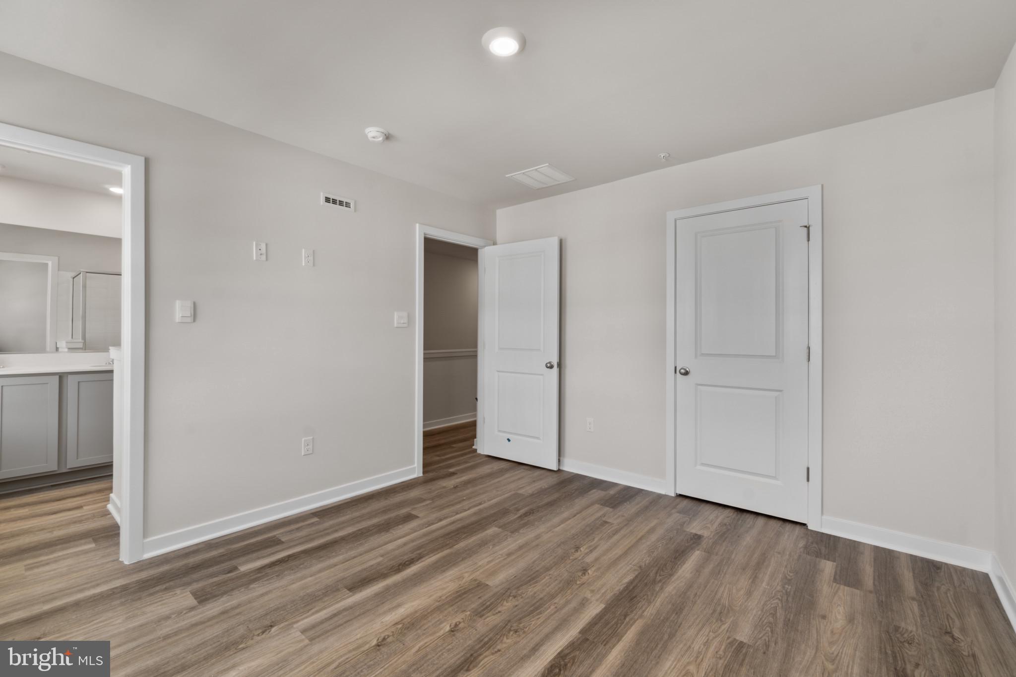 7510 Fern Gully Way Brandywine, MD 20613 - Photo 16 of 31 a view of an empty room and wooden floor