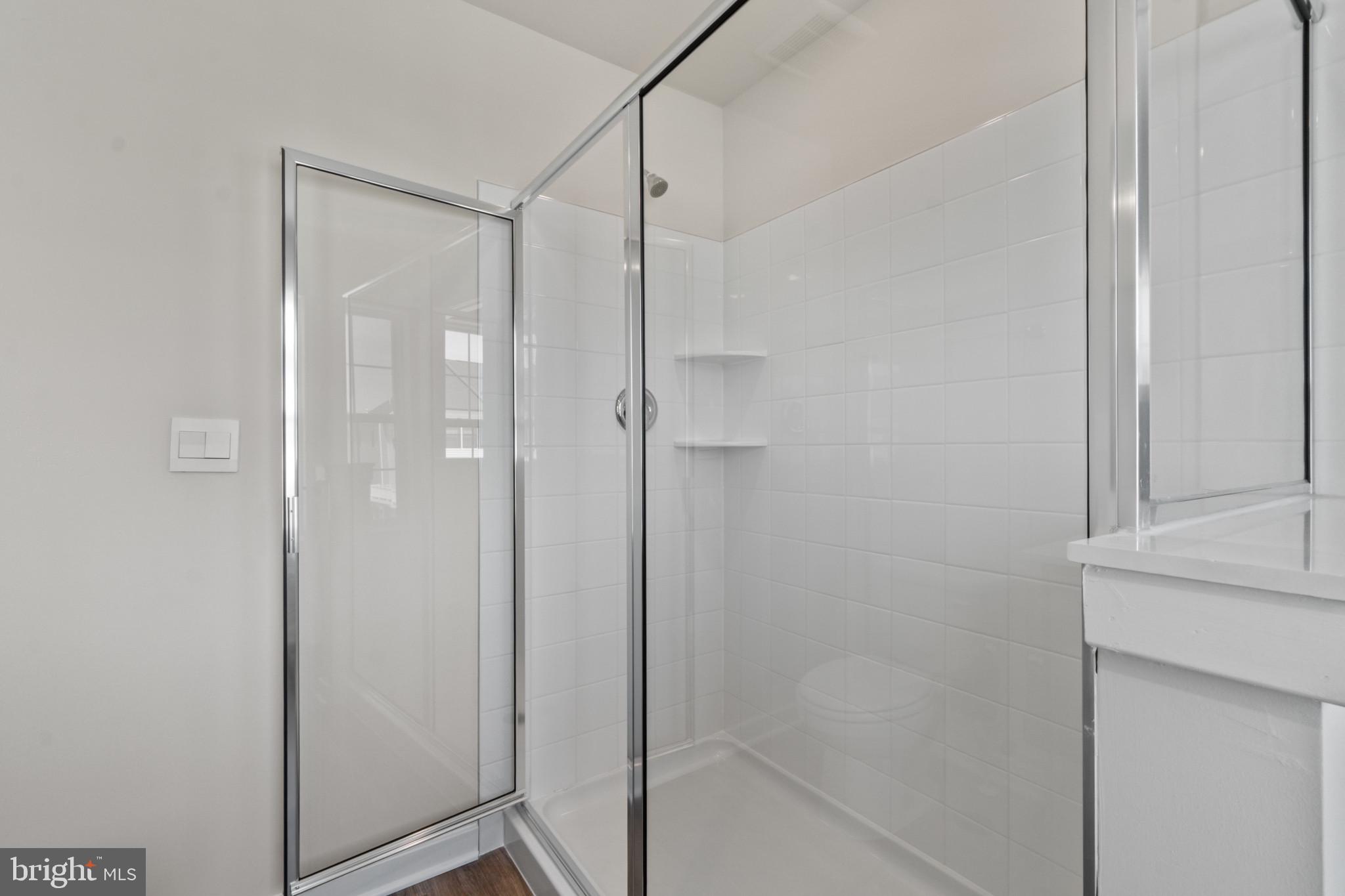 7510 Fern Gully Way Brandywine, MD 20613 - Photo 18 of 31 a bathroom with a shower