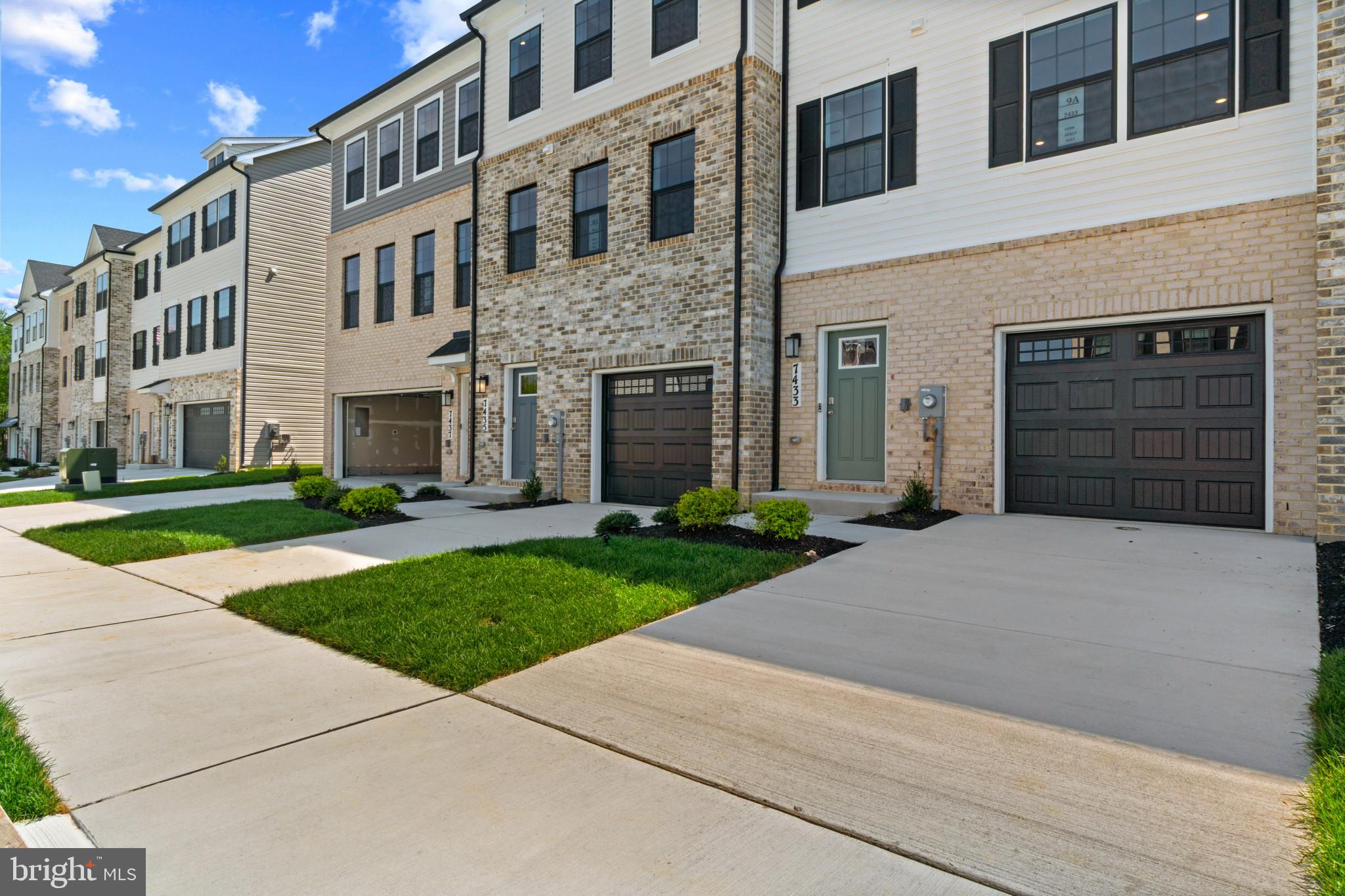 7510 Fern Gully Way Brandywine, MD 20613 - Photo 2 of 31 a front view of a building with a yard