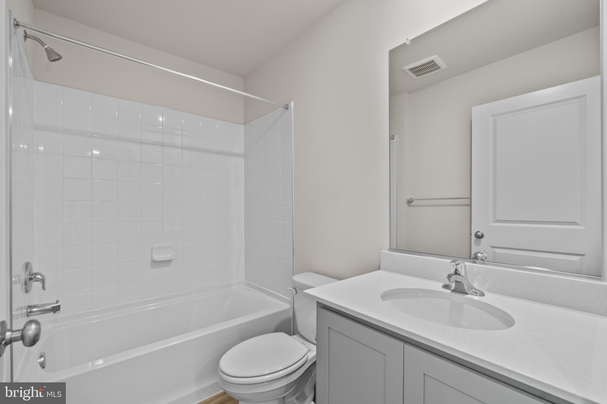 7510 Fern Gully Way Brandywine, MD 20613 - Photo 21 of 31 a bathroom with a sink a toilet and a bathtub