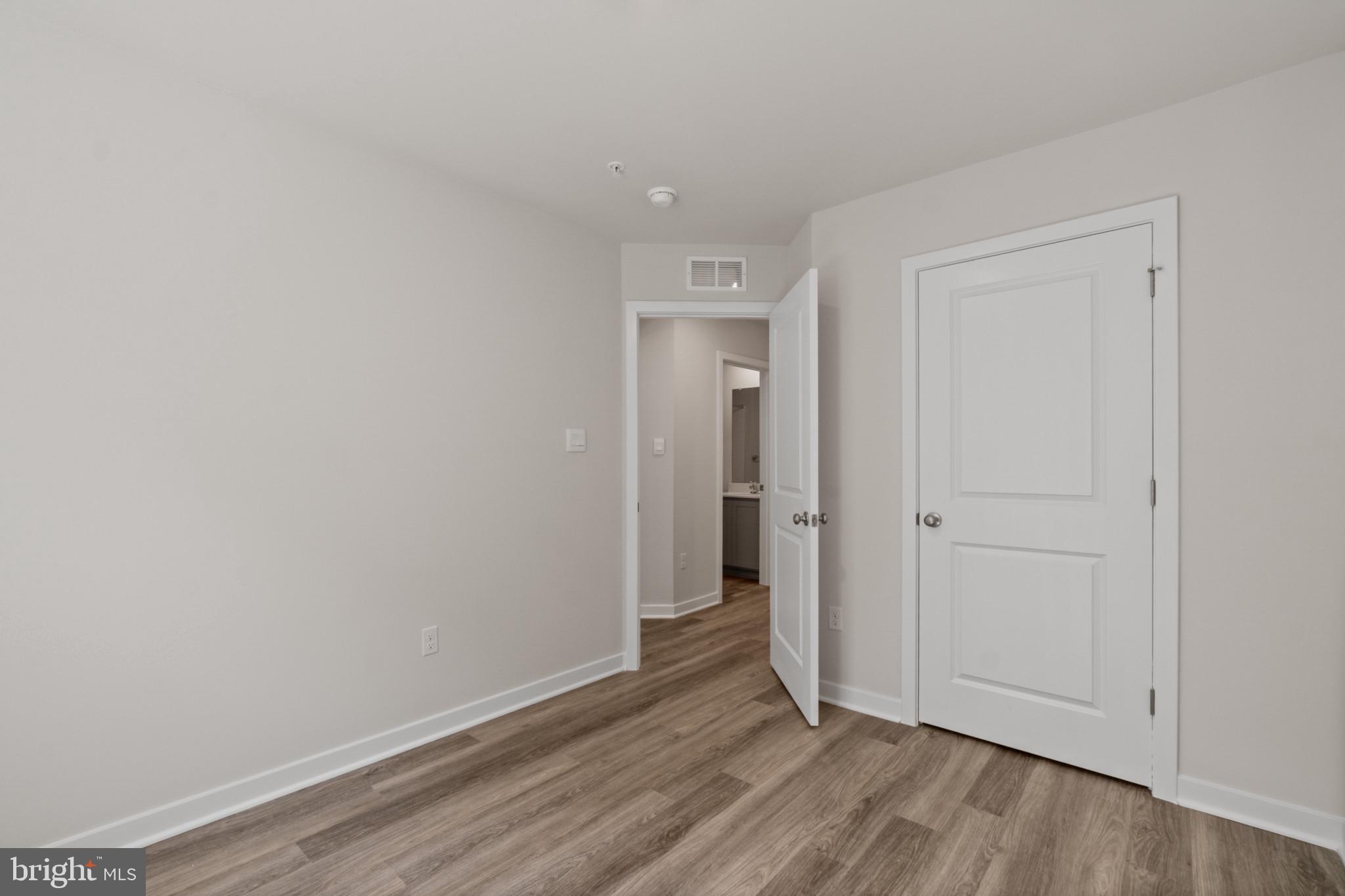 7510 Fern Gully Way Brandywine, MD 20613 - Photo 26 of 31 a view of an empty room and wooden floor