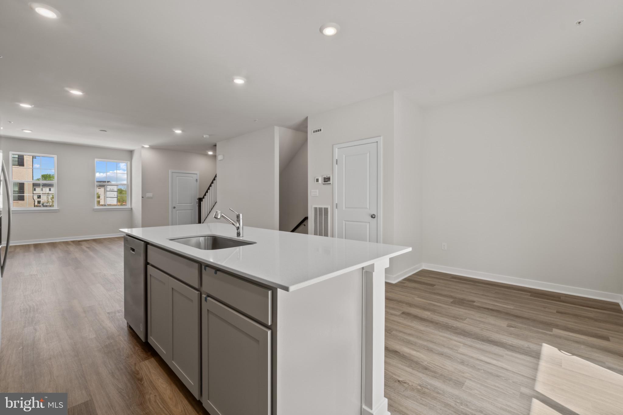 7510 Fern Gully Way Brandywine, MD 20613 - Photo 4 of 31 a kitchen with a sink and wooden floor