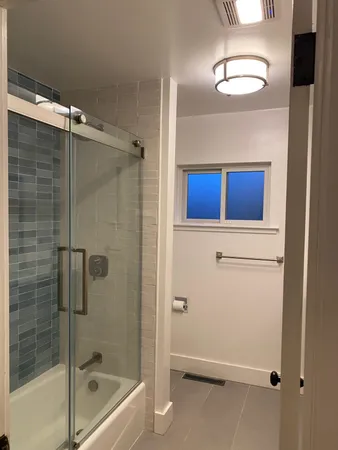 a bathroom with a shower and a bathtub