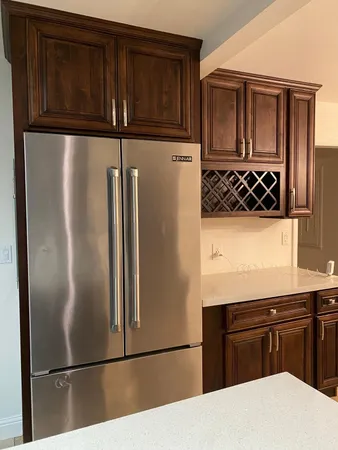 a kitchen with cabinets and stainless steel appliances