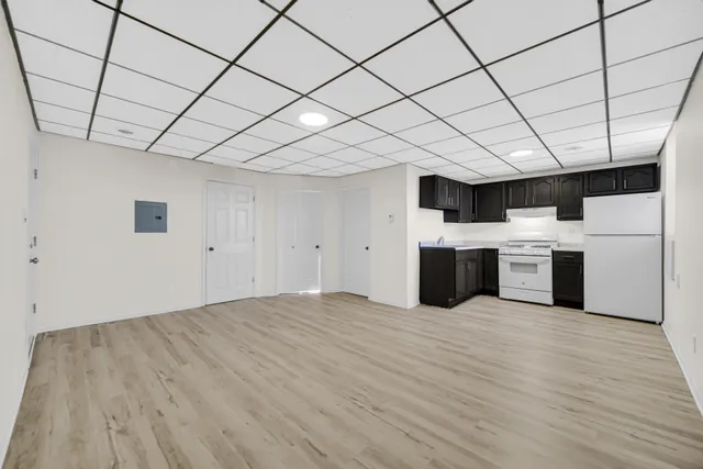 a kitchen with a sink cabinets and microwave