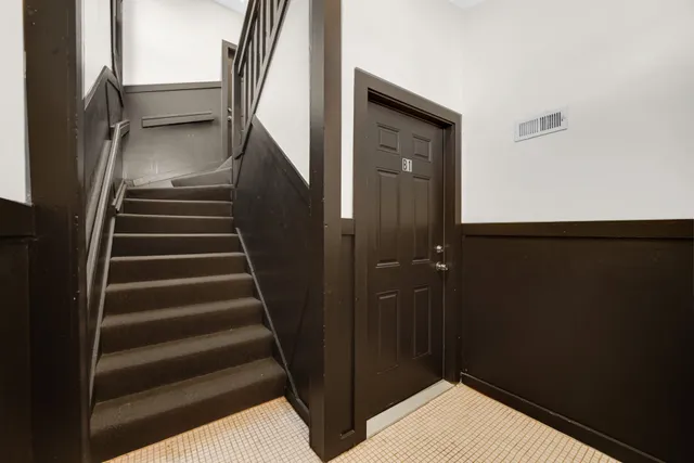 a view of kitchen with wooden floor and electronic appliances
