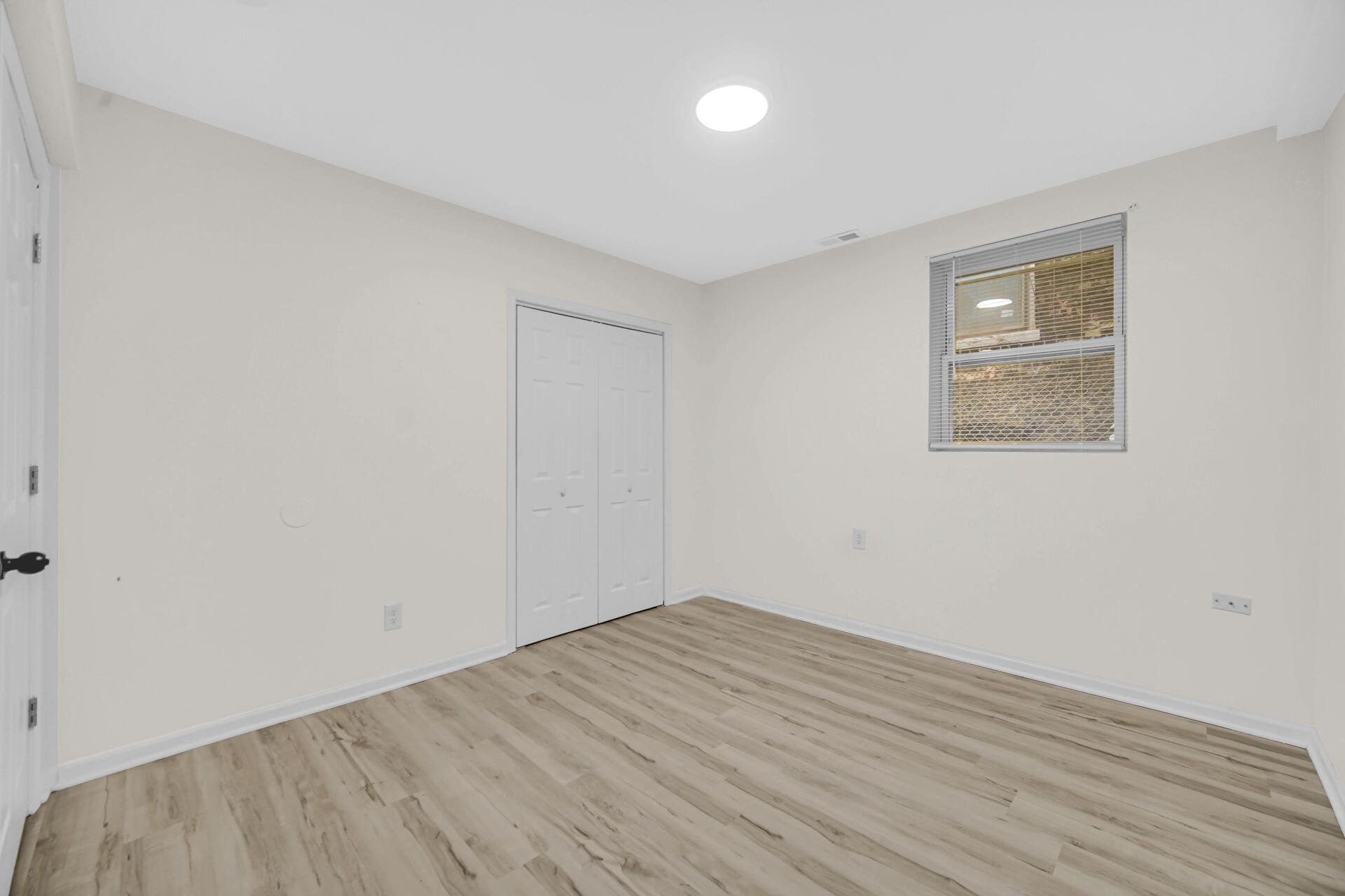 3501 Fir Street East Chicago, IN 46312 - Photo 23 of 26 an empty room with wooden floor and windows