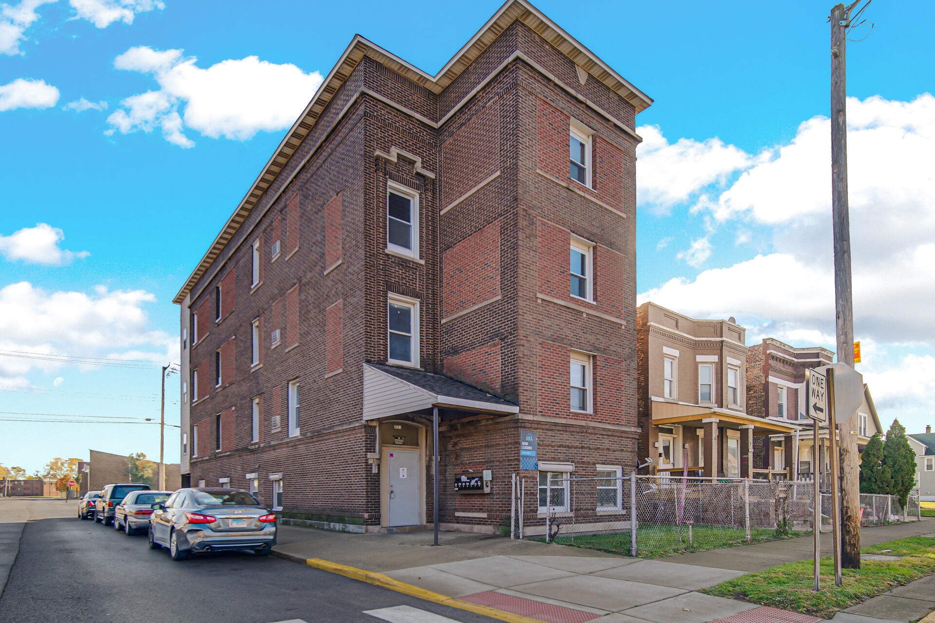 3501 Fir Street East Chicago, IN 46312 - Photo 26 of 26 a city street lined with parked cars and buildings