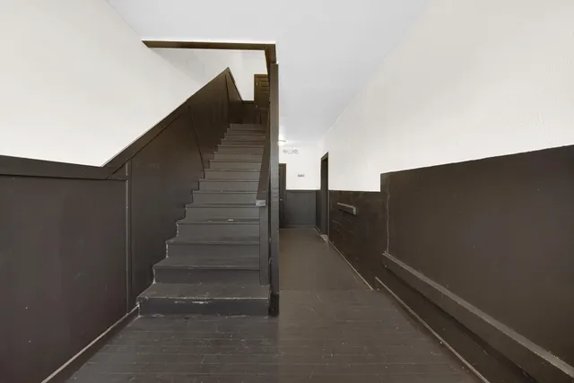 a kitchen with a refrigerator sink and cabinets