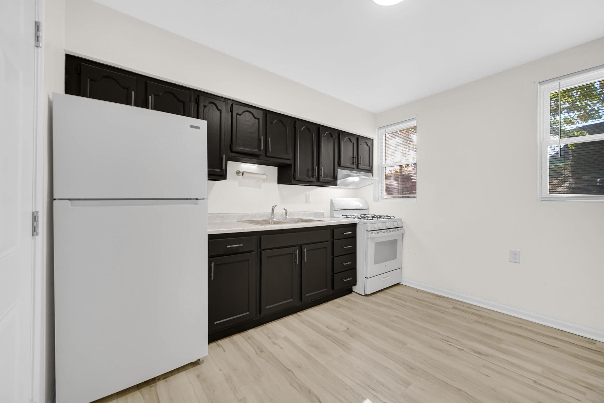 3501 Fir Street East Chicago, IN 46312 - Photo 5 of 26 a kitchen with a refrigerator sink and cabinets