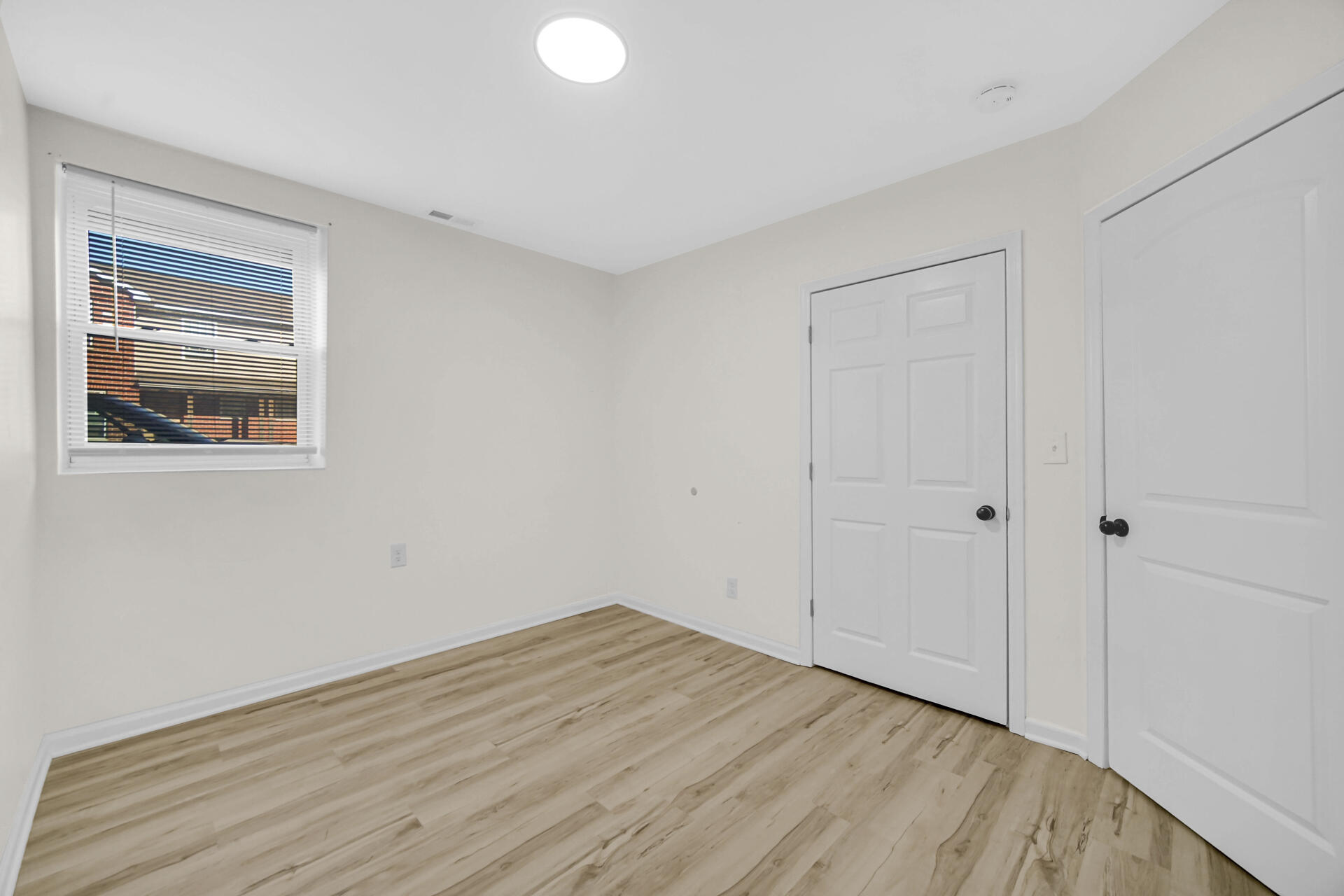 3501 Fir Street East Chicago, IN 46312 - Photo 7 of 26 a view of empty room with wooden floor and fan
