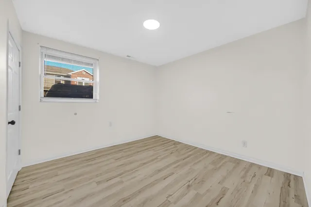 a view of a kitchen with microwave and cabinets