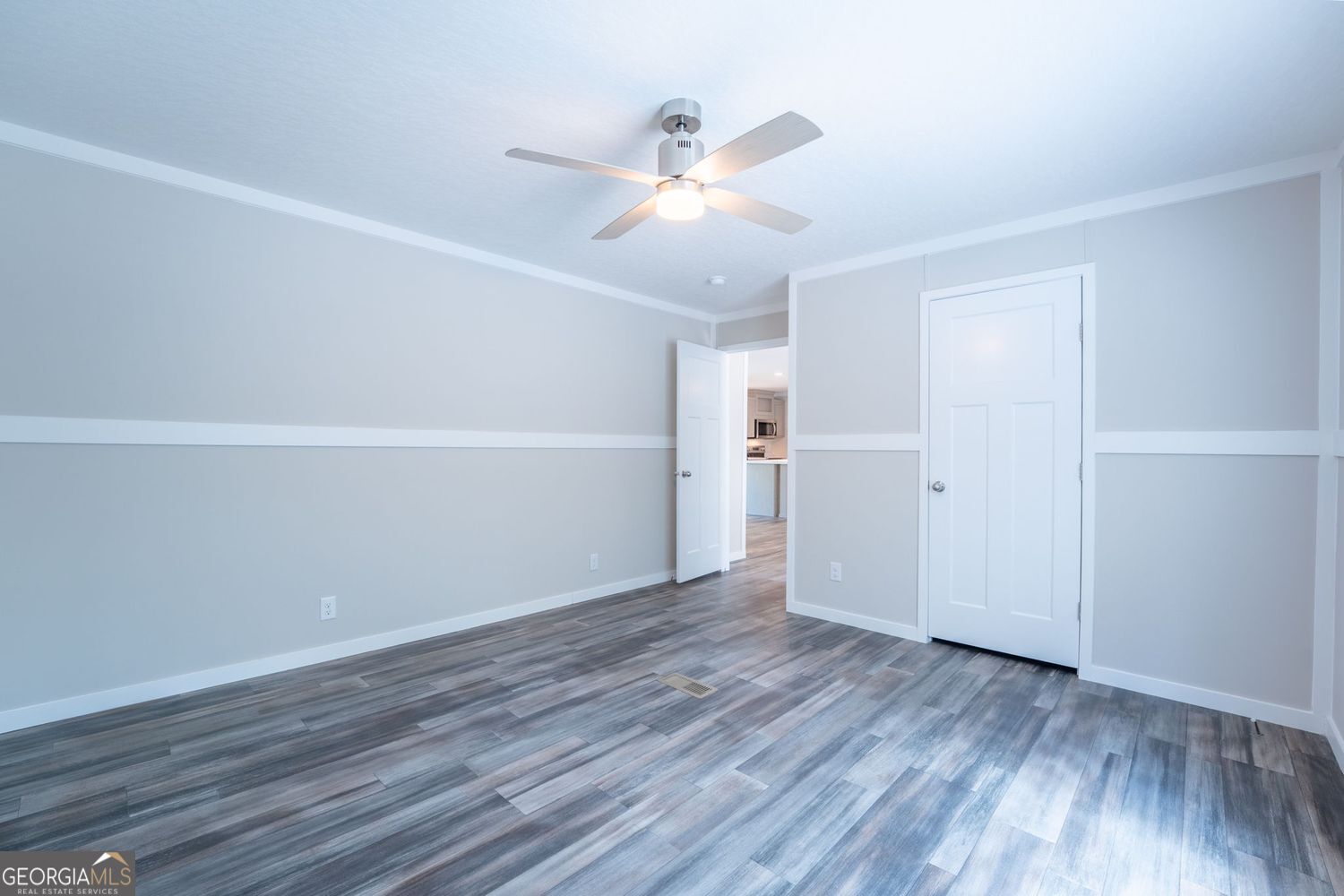 734 Hollywood Church Road Clarkesville, GA 30523 - Photo 26 of 49 a view of an empty room with wooden floor