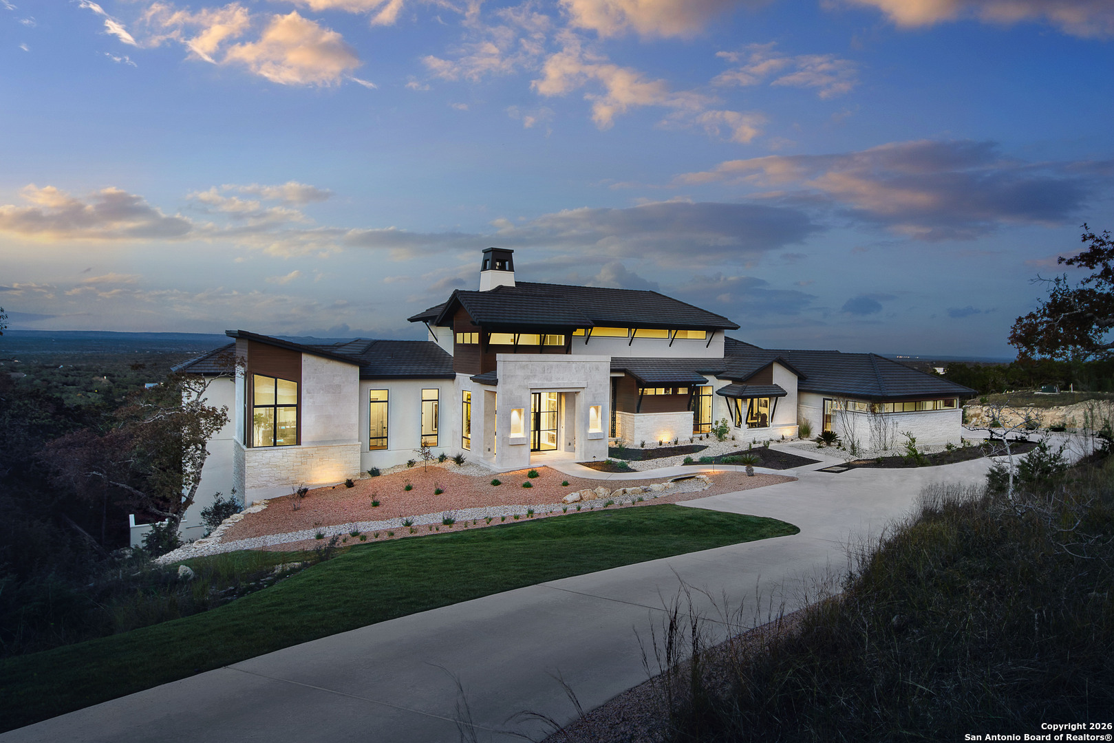 a front view of house with yard and green space