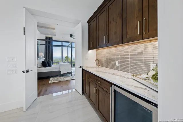 a kitchen with a sink and cabinets