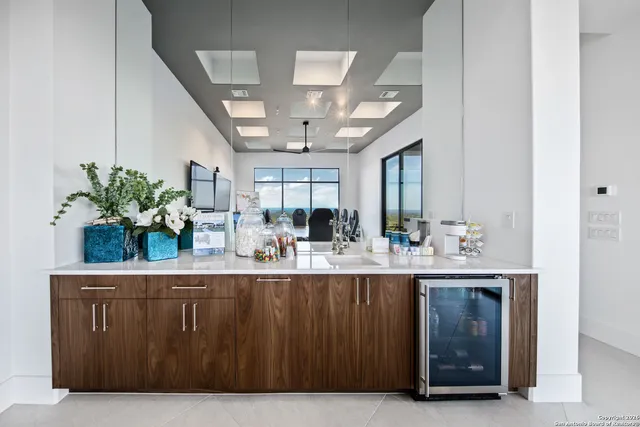 a kitchen with a potted plant on the counter