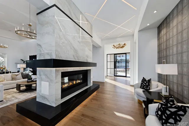 a living room with furniture and a fireplace
