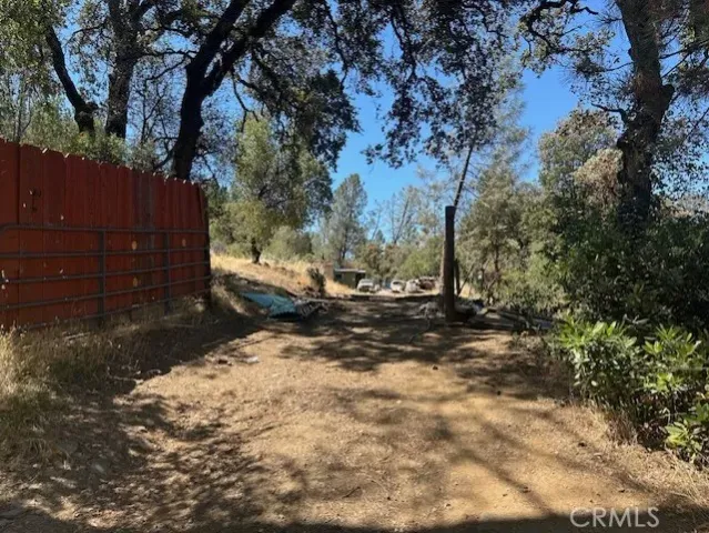 a view of a yard covered with snow in the yard