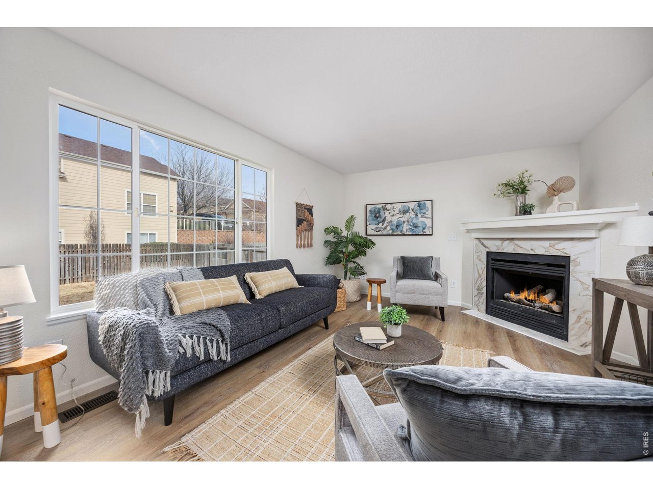 4927 30th Street Greeley, CO 80634 - Photo 13 of 35 a living room with furniture and a fireplace
