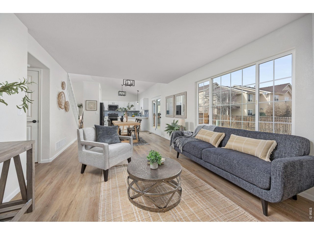 4927 30th Street Greeley, CO 80634 - Photo 14 of 35 a living room with furniture and a large window