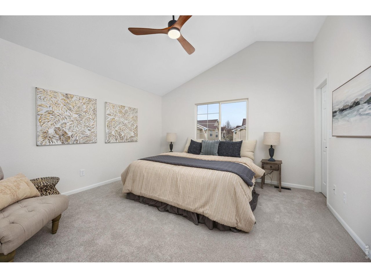 4927 30th Street Greeley, CO 80634 - Photo 17 of 35 a bedroom with a bed and a painting on the wall
