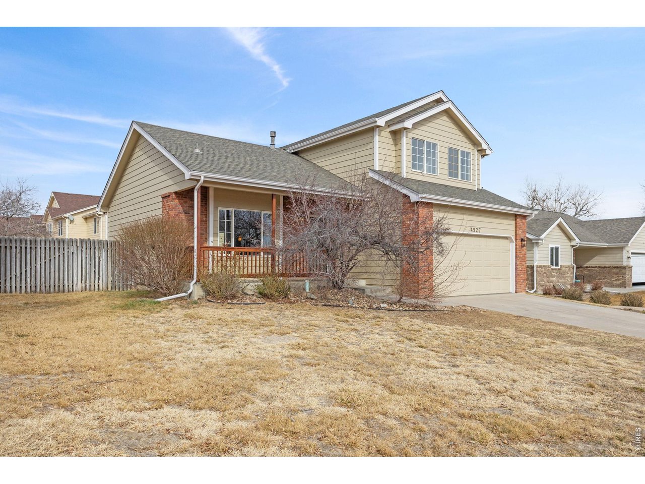 4927 30th Street Greeley, CO 80634 - Photo 2 of 35 a view of a house with a yard