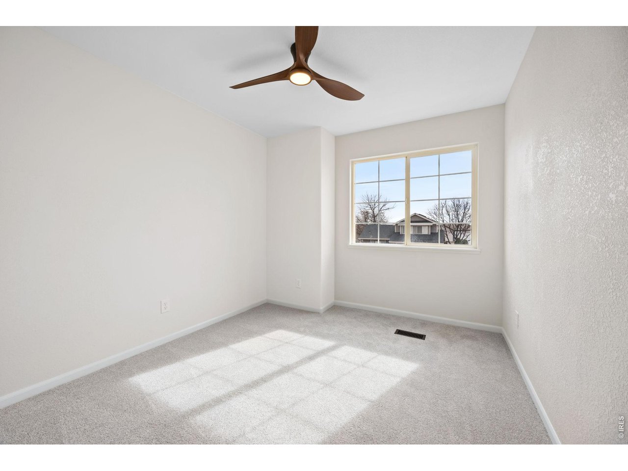 4927 30th Street Greeley, CO 80634 - Photo 24 of 35 a view of an empty room with a window