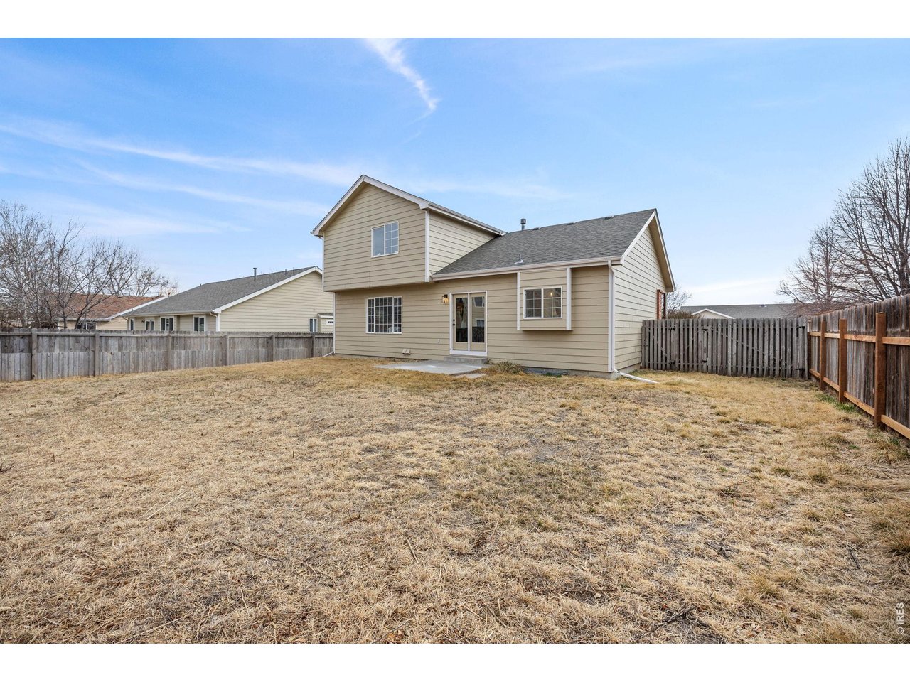 4927 30th Street Greeley, CO 80634 - Photo 29 of 35 a front view of a house with a yard