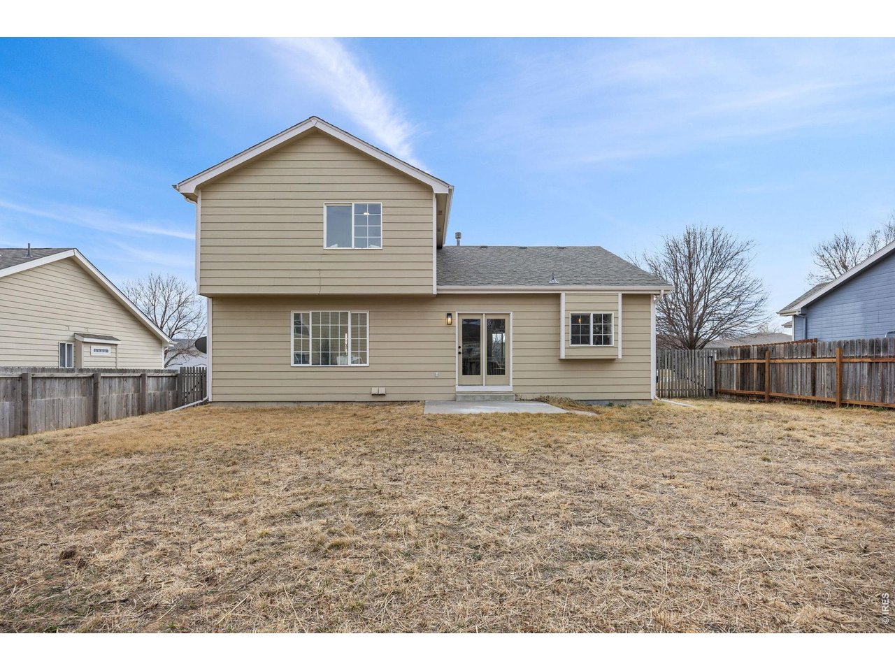 4927 30th Street Greeley, CO 80634 - Photo 30 of 35 a front view of a house with a yard