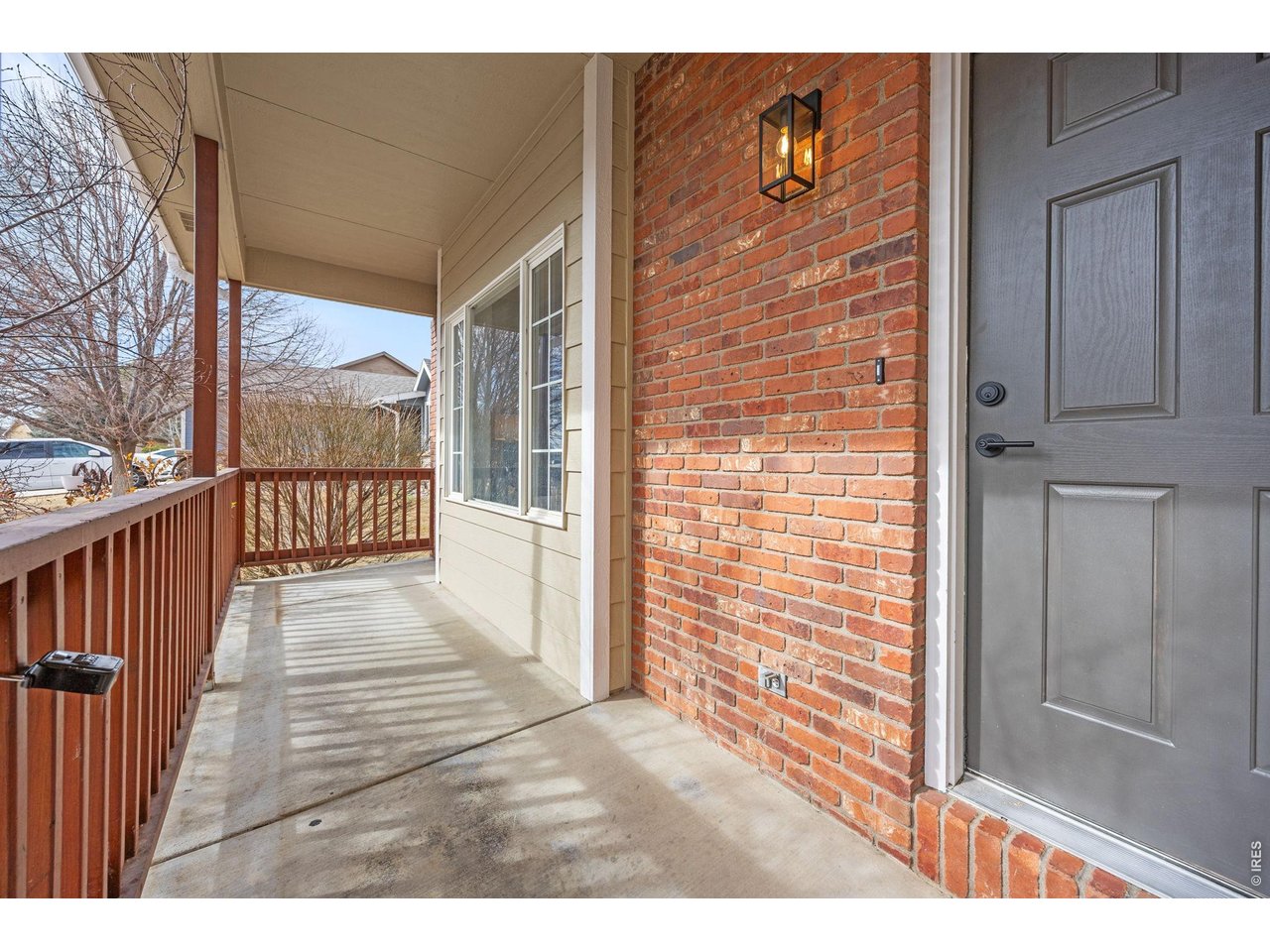 4927 30th Street Greeley, CO 80634 - Photo 4 of 35 a view of a porch with wooden floor and city view