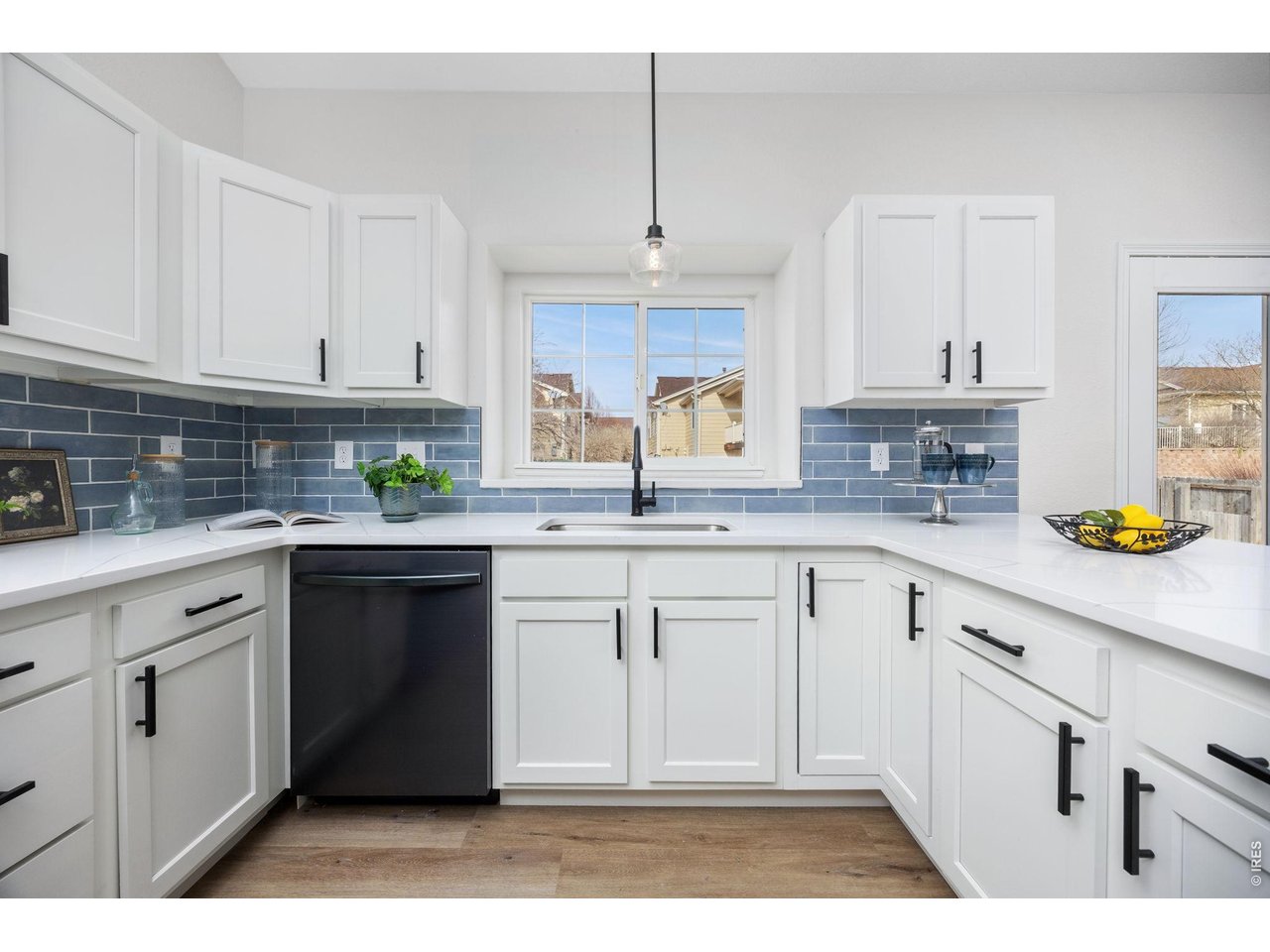4927 30th Street Greeley, CO 80634 - Photo 9 of 35 a kitchen with appliances cabinets and a sink