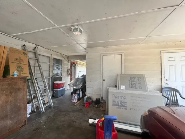 a view of a livingroom with furniture and windows