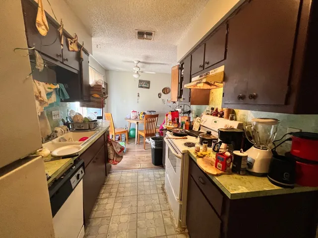 a kitchen with lots of appliances
