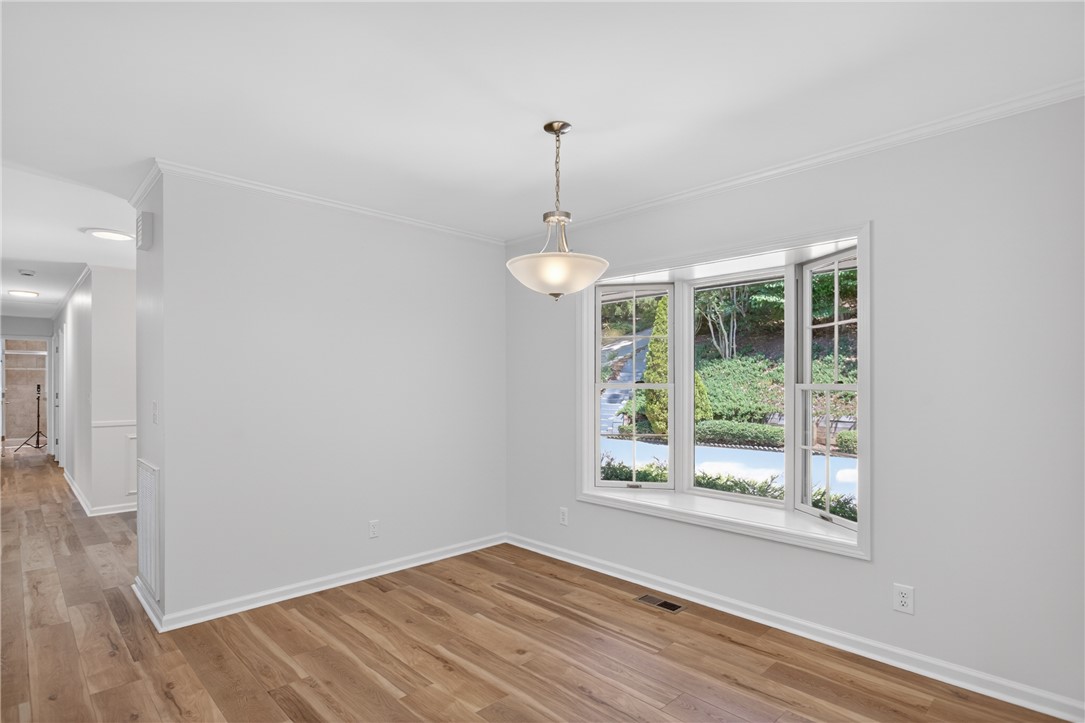 9 Lookout Lane Salem, SC 29676 - Photo 13 of 46 Bright hardwood floors and a striking bay window define this inviting dining area.