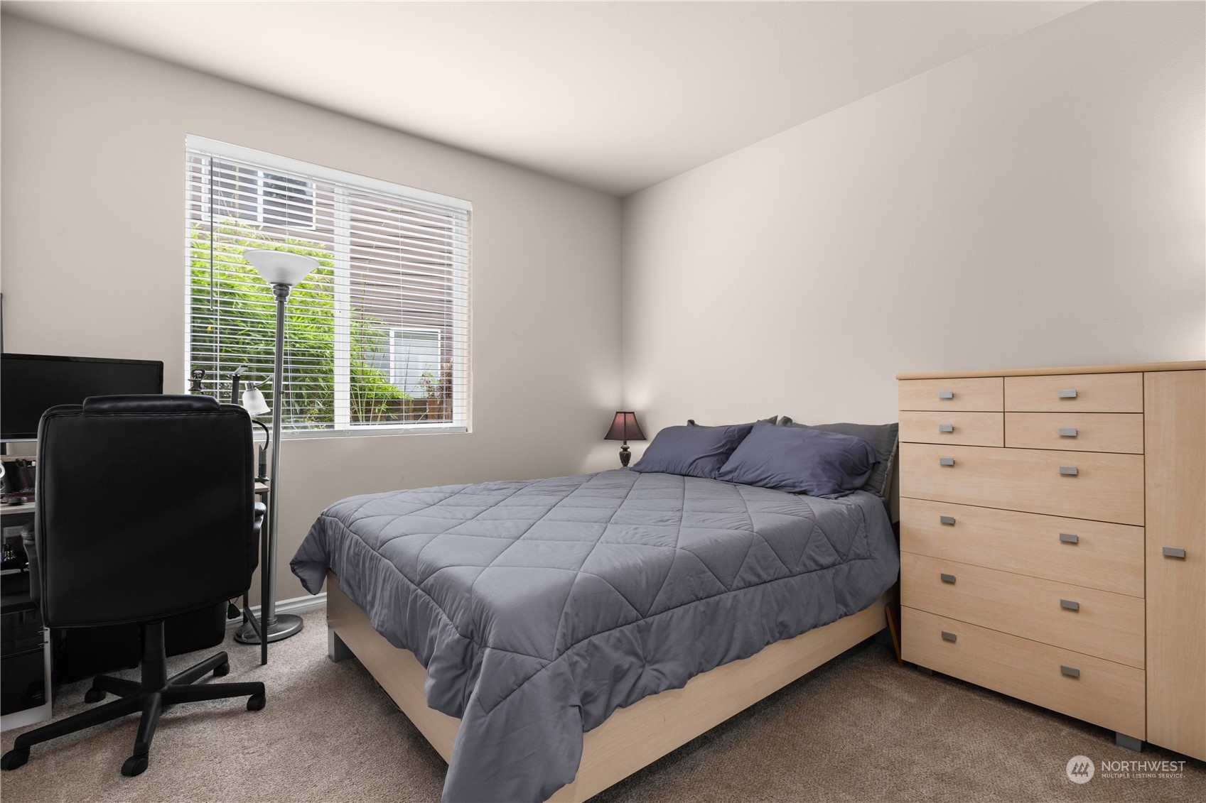 27746 Maple Ridge Way Southeast Maple Valley, WA 98038 - Photo 13 of 37 a bed room with a bed and a chair