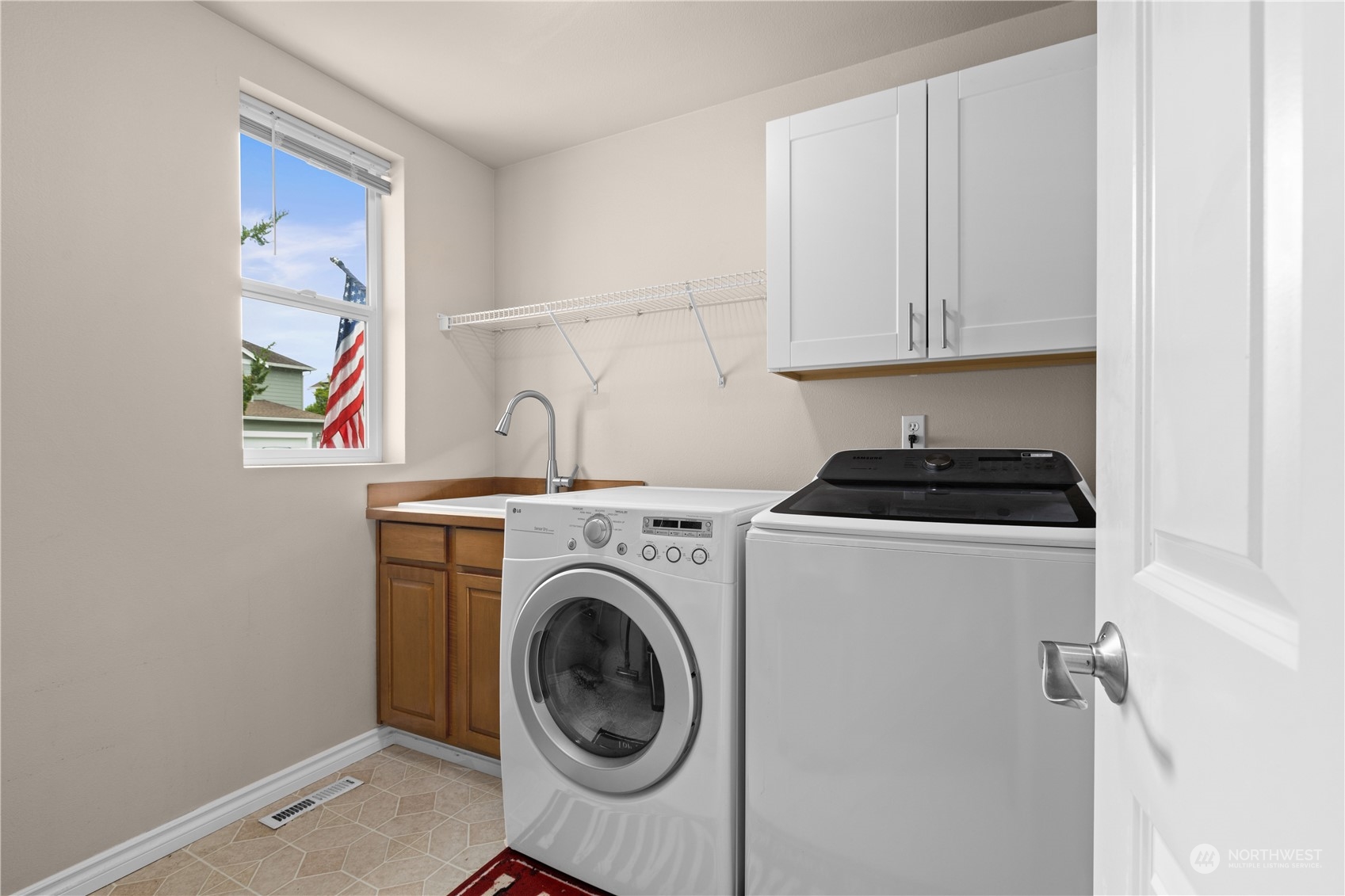 27746 Maple Ridge Way Southeast Maple Valley, WA 98038 - Photo 14 of 37 a utility room with dryer and washer