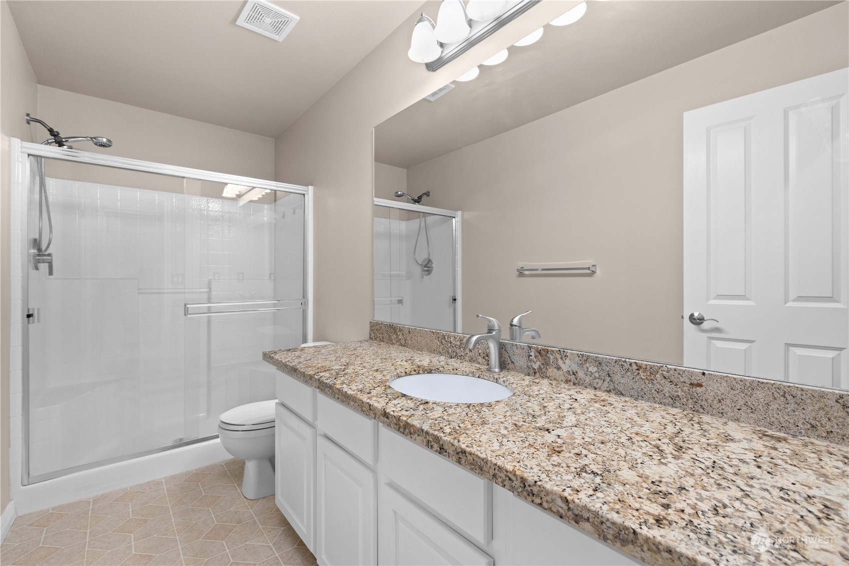 27746 Maple Ridge Way Southeast Maple Valley, WA 98038 - Photo 15 of 37 a bathroom with a granite countertop sink toilet and shower