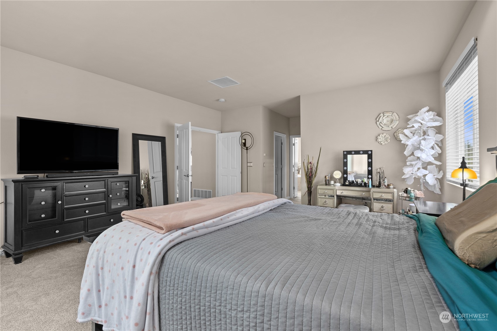 27746 Maple Ridge Way Southeast Maple Valley, WA 98038 - Photo 18 of 37 a bedroom with a bed and a flat screen tv