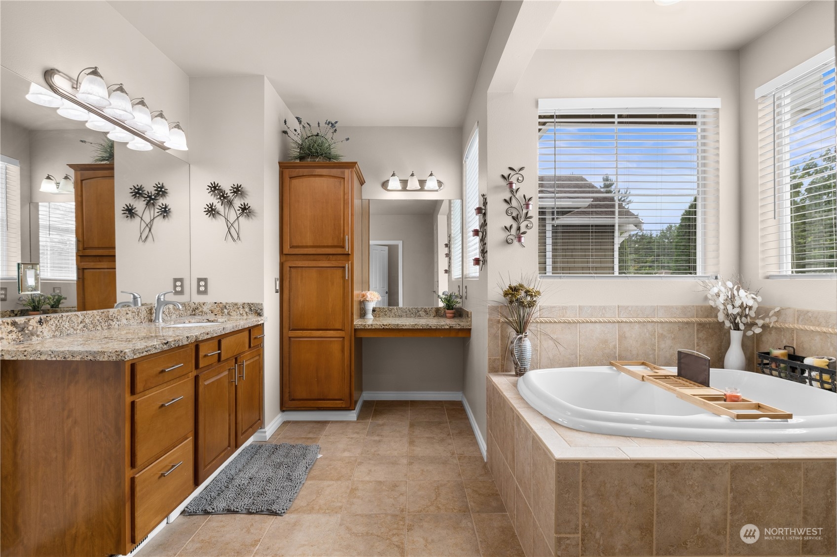 27746 Maple Ridge Way Southeast Maple Valley, WA 98038 - Photo 19 of 37 a bathroom with a tub sink and mirror