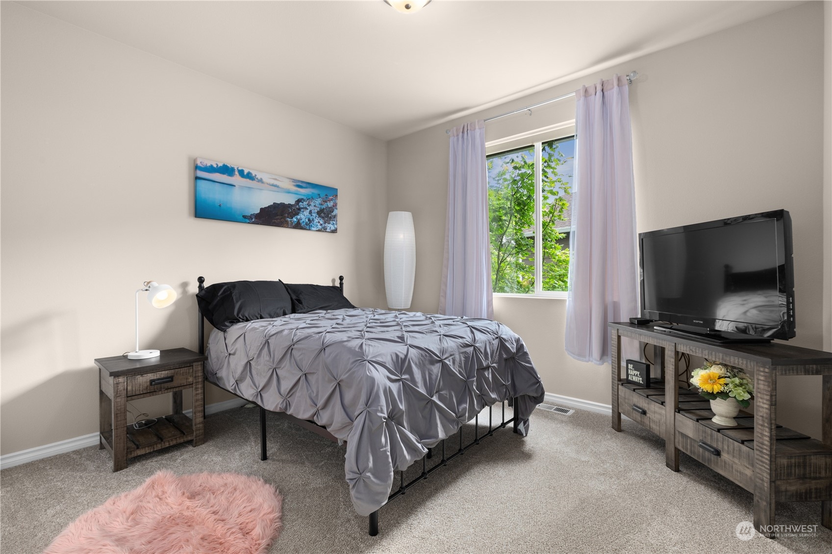 27746 Maple Ridge Way Southeast Maple Valley, WA 98038 - Photo 23 of 37 a bedroom with a bed and a flat screen tv