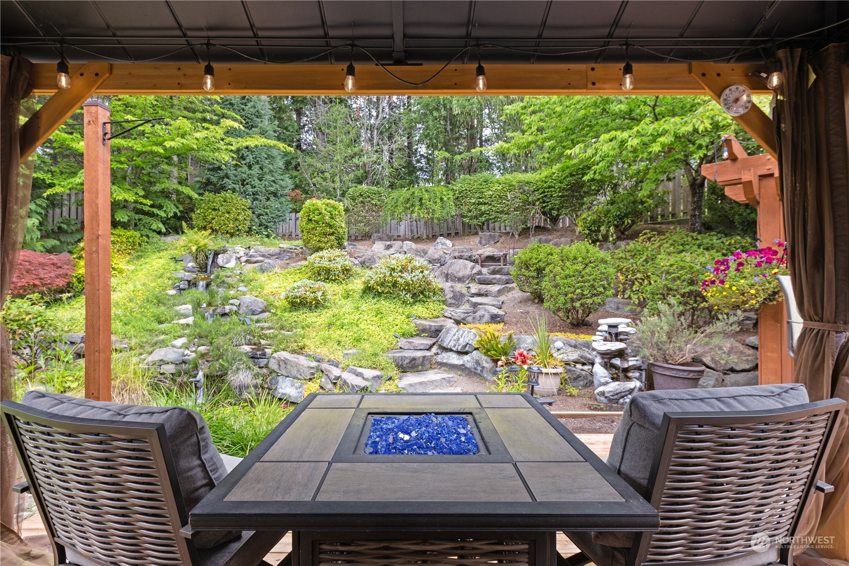 27746 Maple Ridge Way Southeast Maple Valley, WA 98038 - Photo 29 of 37 a outdoor view with sitting space and a garden