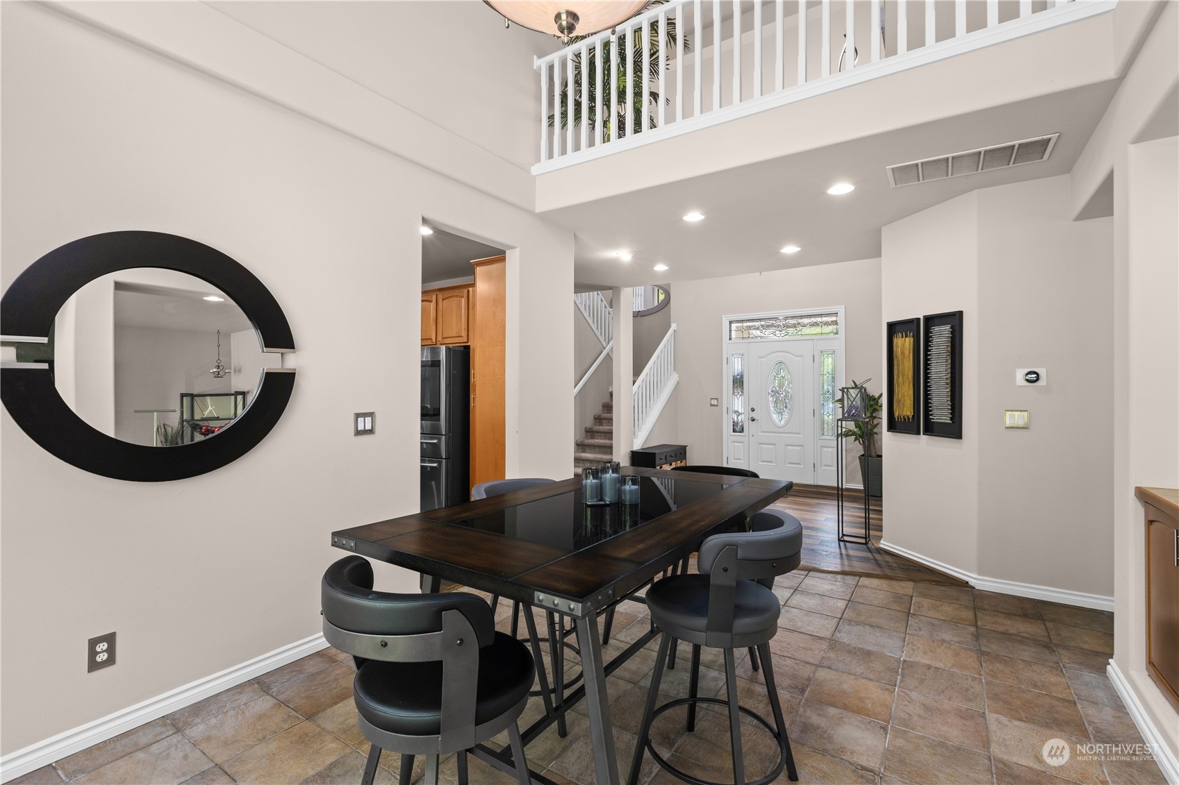 27746 Maple Ridge Way Southeast Maple Valley, WA 98038 - Photo 5 of 37 a view of a dining room with furniture and a chandelier