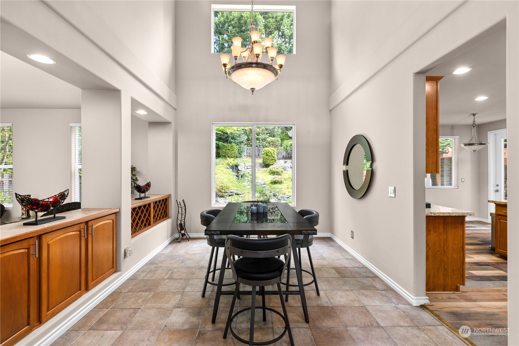 27746 Maple Ridge Way Southeast Maple Valley, WA 98038 - Photo 6 of 37 a view of a dining room with furniture and a large window