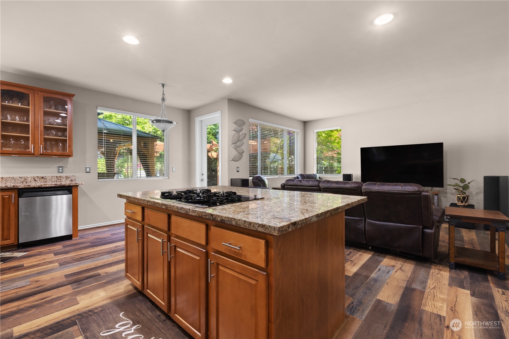 27746 Maple Ridge Way Southeast Maple Valley, WA 98038 - Photo 7 of 37 a kitchen with stainless steel appliances granite countertop a stove and a sink