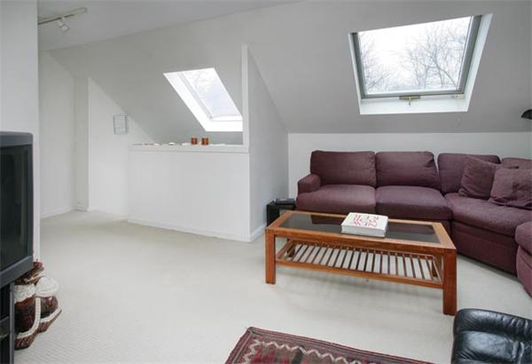 55 Truman Road Newton, MA 02459 - Photo 7 of 8 a living room with furniture a flat screen tv and a couch